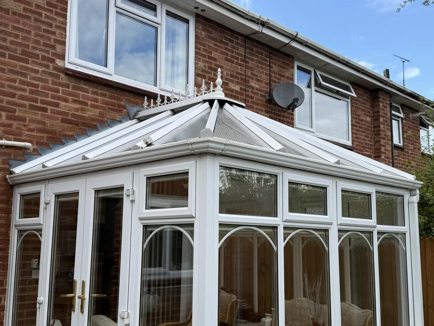 Clean white uPVC conservatory viewed from the corner