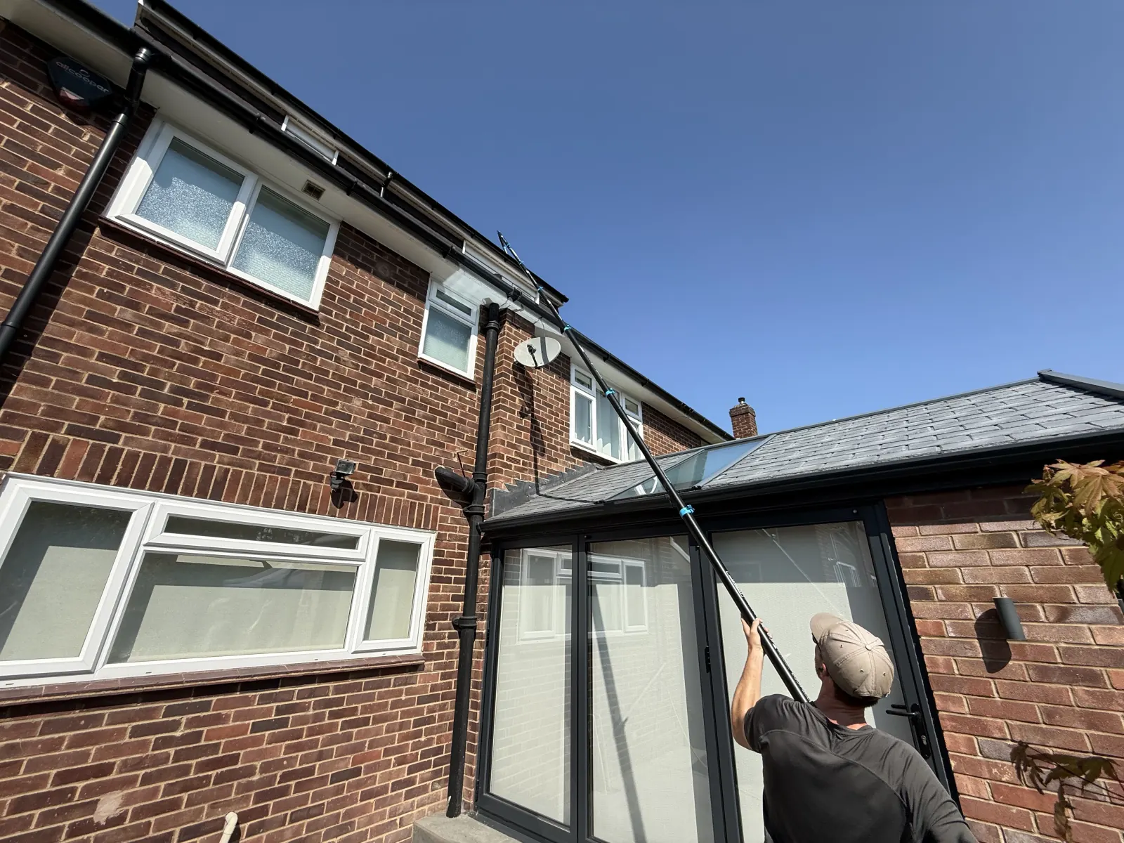 High-reach gutter cleaning at a residential property