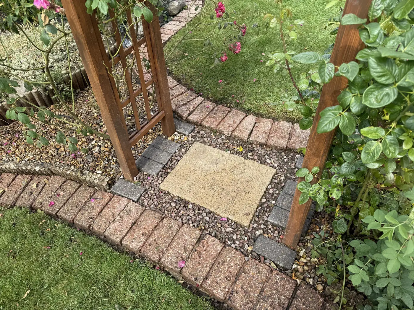 Clean paved garden entrance and brick edging