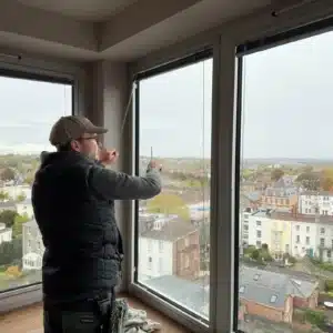 Person cleaning an interior window