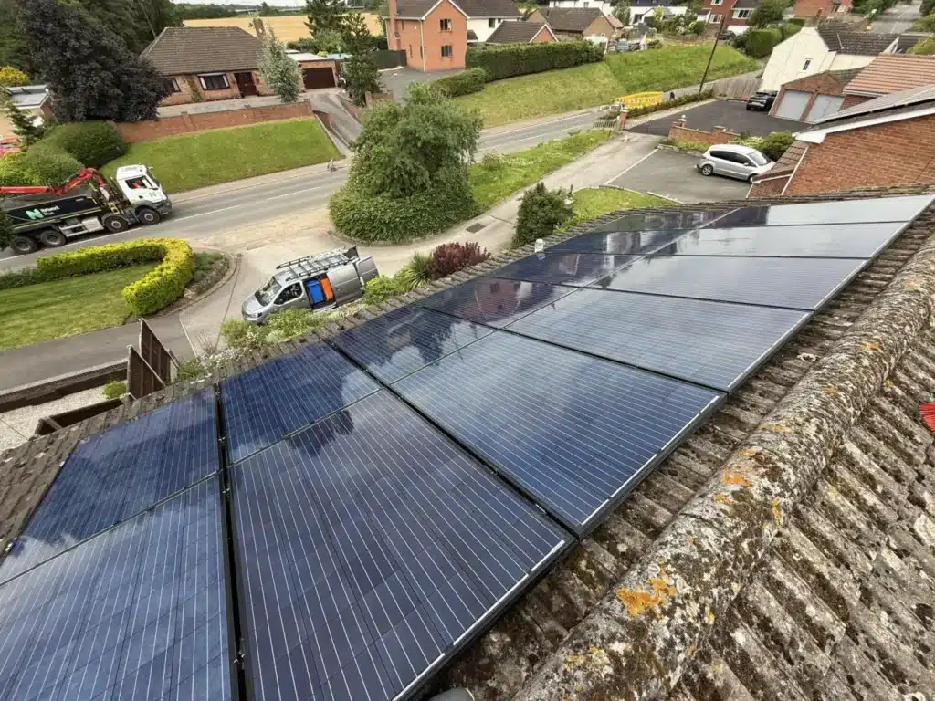 Clean residential solar panels viewed across a roof in Gloucestershire