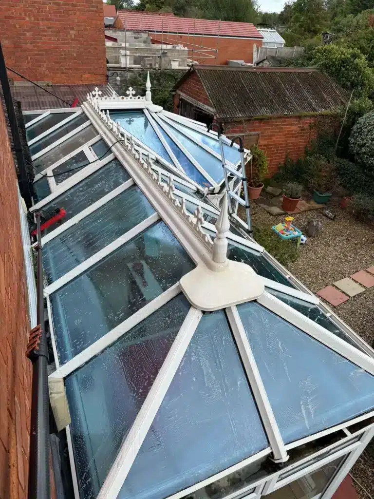 View along the adjoining conservatory roof sections and white glazing bars at the Finlay Road property