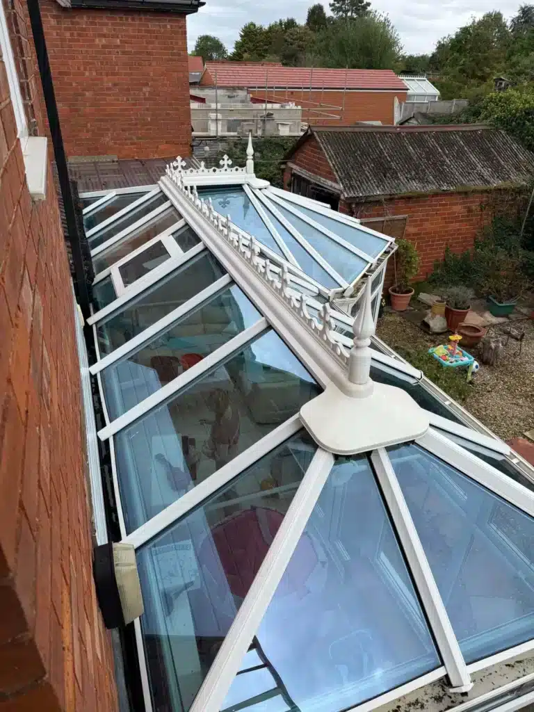Clean glass roof panels and white decorative ridge on the conservatory at Finlay Road, Gloucester