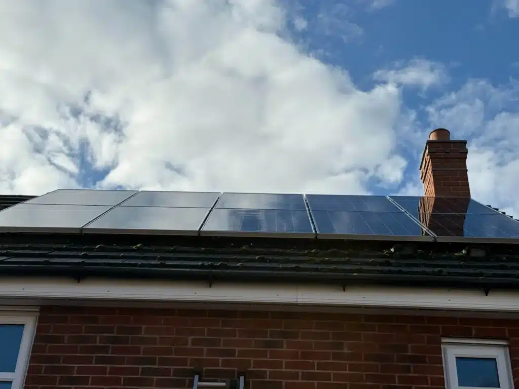 Solar panels above the white fascia at the property in Uckington, Cheltenham